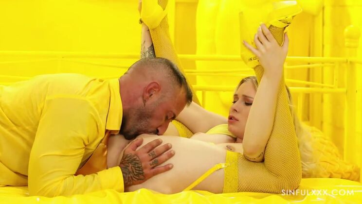 Blonde with Tattoos Swallows Hard in Yellow